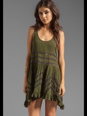 Free People Voile and Lace
Trapeze Slip Dress in olive green. XS